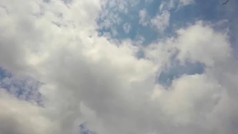 Time Lapse of White Cloud Movement on a Sunny day Stock Footage 304858595