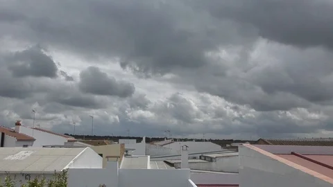 Time lapse with white clouds above Spanish houses Stock-Footage 100439425
