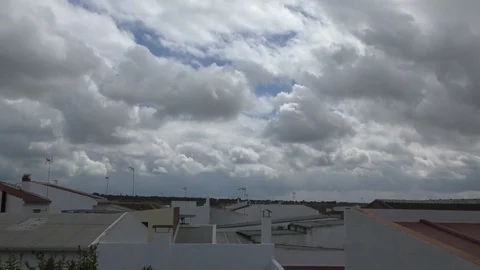 Time lapse with white clouds above Spanish houses Stock-Footage 100439438