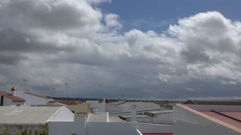 Time lapse with white clouds above Spanish houses Stock-Footage 100439507