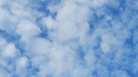 Time lapse, white clouds against blue sky for a background, 4K Stock Footage 77196718