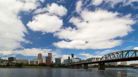 Time lapse of white clouds and blue sky over downtown skyline of Portland Oregon Stock-Footage 66525872