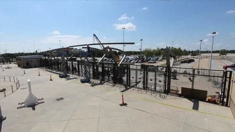 Time-lapse of white clouds and construction of sports stadium Stock Footage 105423024