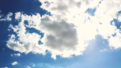 Time lapse White Clouds and Hot Sun On Blue Sky Stock Footage 133332348