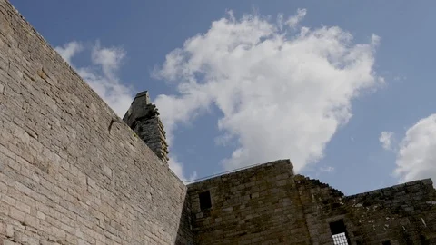 Time Lapse-White clouds blow past ramparts of Caernarfon Castle Wales Stock Footage 96030457