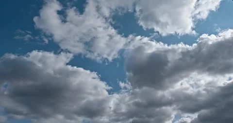 Time-lapse White Clouds on Blue Sky. Sunny Weather 4K 10-bit Stock Footage 274556582