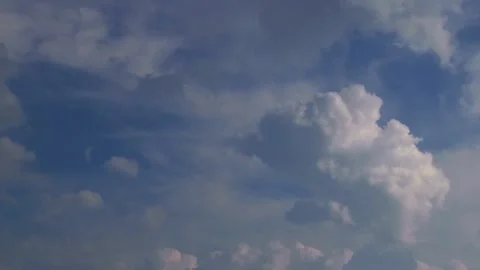 Time lapse of white clouds developing in the shape of a cumulus on blue sky Stock Footage 138923066