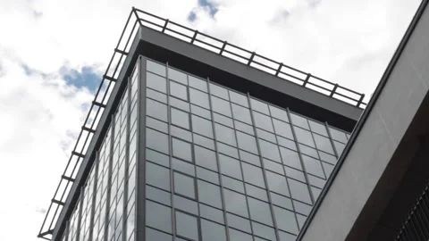 Time lapse, white clouds fly over a tall building bottom view Stock Footage 131951359