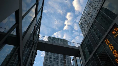 Time lapse of the white clouds flying over office buildings in Beijing's CBD Stock Footage 94641563