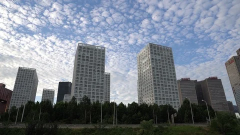 Time lapse of the white clouds flying over buildings in Beijing's CBD Stock Footage 94642043