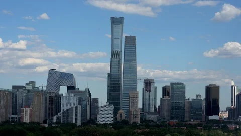 Time lapse of the white clouds flying over the city skyline of Beijing Stock-Footage 94706363