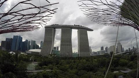 Time lapse of white clouds flying over Marina Bay Sands in downtown Singapore Stock Footage 113546414