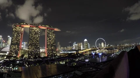 Time lapse of white clouds flying over Marina Bay Sands in downtown Singapore Stock Footage 113546891