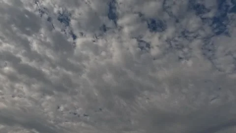 Time Lapse White Clouds Flying Moving in Blue Sky with Sun Rays background Stock Footage 253665591