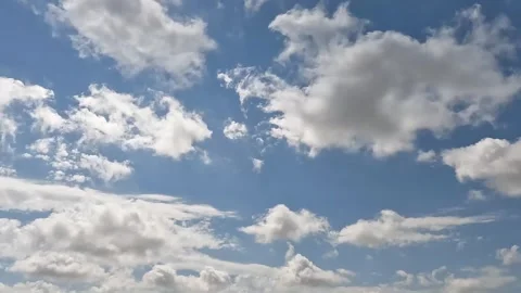 Time Lapse White Clouds Flying Moving in Blue Sky with Sun Rays background Stock Footage 253665652