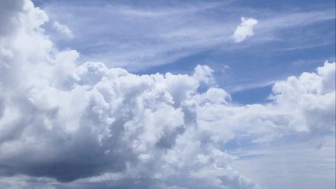 A time lapse of white clouds moving across a blue sky. Stock-Footage 107461718