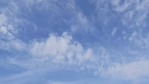 A time lapse of white clouds moving across a blue sky. Stock-Footage 108200026