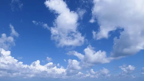 A time lapse of white clouds moving across a blue sky. Stock-Footage 115964220