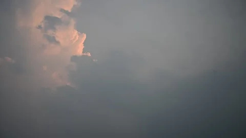 Time-lapse of white clouds moving in the evening sky Stock Footage 332163417