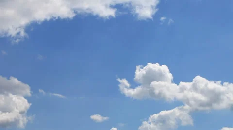 Time lapse of  white clouds over blue sky Stock Footage 38939303