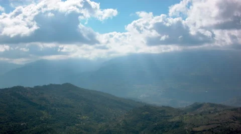 Time-Lapse of White clouds over mountains Stock Footage 52056216