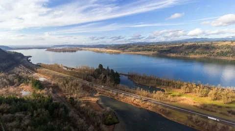 Time Lapse of white clouds over Columbia River Gorge along interstate highway Stock Footage 59526787
