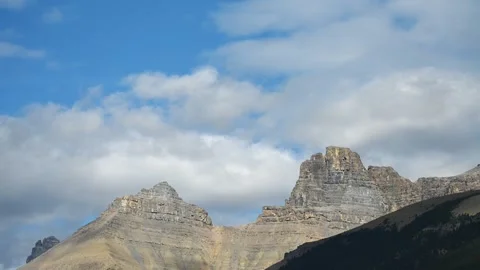 Time lapse of white clouds over a rugged mountain in Banff Park Stock Footage 287037838