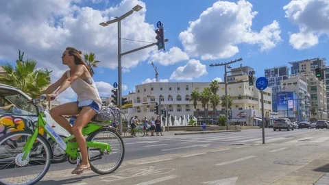 Time lapse of white clouds passing over a modern city road, Tel Aviv, Israel Stock Footage 85960261