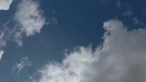Time lapse of white clouds on sunny blue sky Stock Footage 138887447