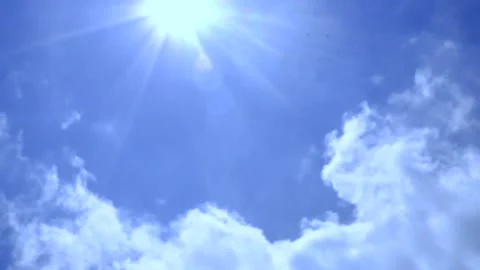 Time lapse white clouds with sunshine and bluesky Stock Footage