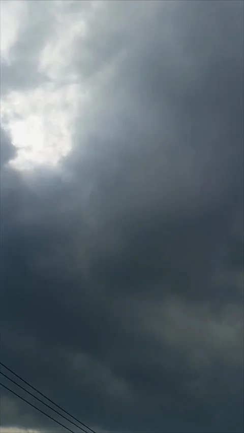 Time lapse of white clouds turning dark Stock Footage 324875095