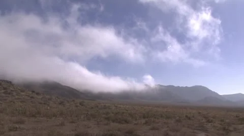 A time-lapse of white clouds in the veld. Stock Footage 16584929