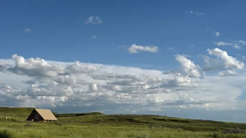 Time lapse of white colored Cumulus clouds moving quickly through a blue sky  Stock Footage 279096726