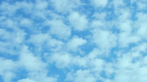 Time Lapse of White Cumulus Clouds Flying in Blue Sunny Sky 4K. Beautiful Aerial Stock Footage 229162416