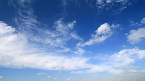 Time lapse, white fluffy clouds over blue sky Stock-Footage 939957