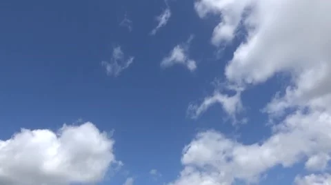 Time lapse of white fluffy clouds on a Blue Sky Stock Footage 51021998