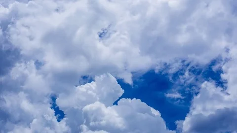 Time lapse of white fluffy clouds Dissolving In The blue sky. Stock Footage 76507123