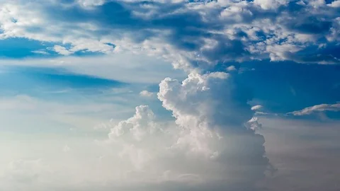 Time lapse of white fluffy clouds Dissolving In The blue sky. Stock Footage 76507207