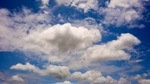 Time lapse of white fluffy clouds Dissolving In The blue sky. Stock Footage 76507406