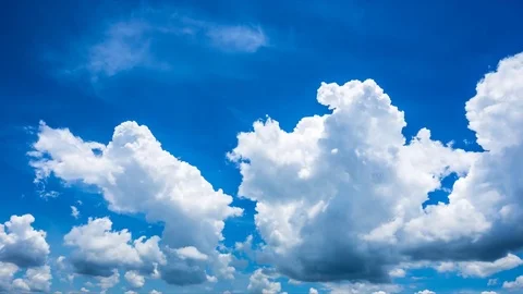 Time lapse of white fluffy clouds Dissolving In The blue sky. Stock Footage 76507669