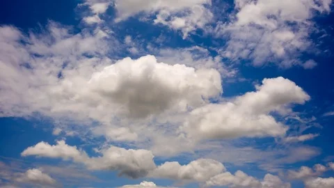 Time lapse of white fluffy clouds Dissolving In The blue sky. Stock Footage 76507716