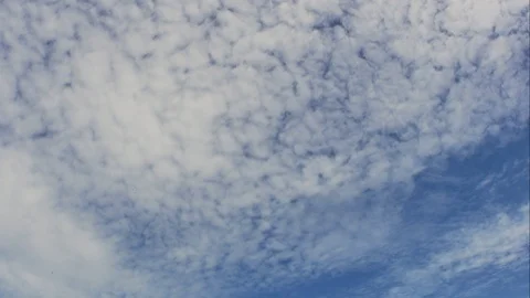 Time Lapse of White fluffy clouds in the blue sky background. Video stock 94211698