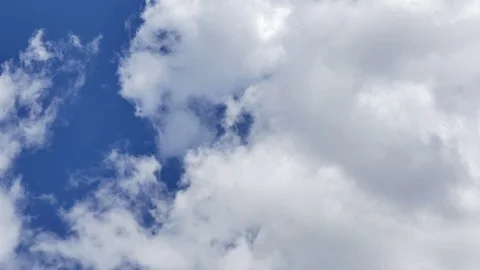 Time Lapse of White fluffy clouds in the blue sky background Stock Footage 94271096