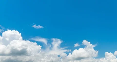 Time lapse white fluffy clouds over blue sky Stock Footage 96202714