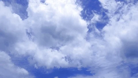 Time lapse white fluffy clouds over blue sky Stock Footage 115147830
