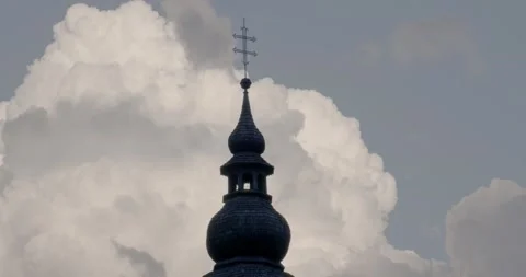 Time lapse of white fluffy clouds moving behind church tower Stock Footage 156658457