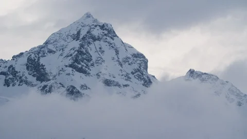 Time-lapse of white foggy clouds over the Alps in winter Stock Footage 113238668