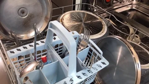 Time lapse of a white hand empties a modern dishwasher. Stock-Footage 79853765