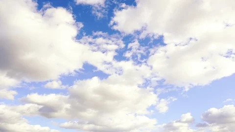 Time lapse of white moving clouds. Cloud running across the blue sky. Stock Footage 111344274