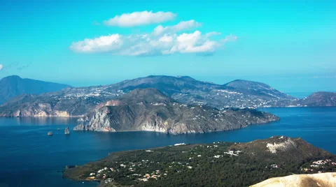 Time-Lapse of White puffy clouds over island Stock-Footage 52056209